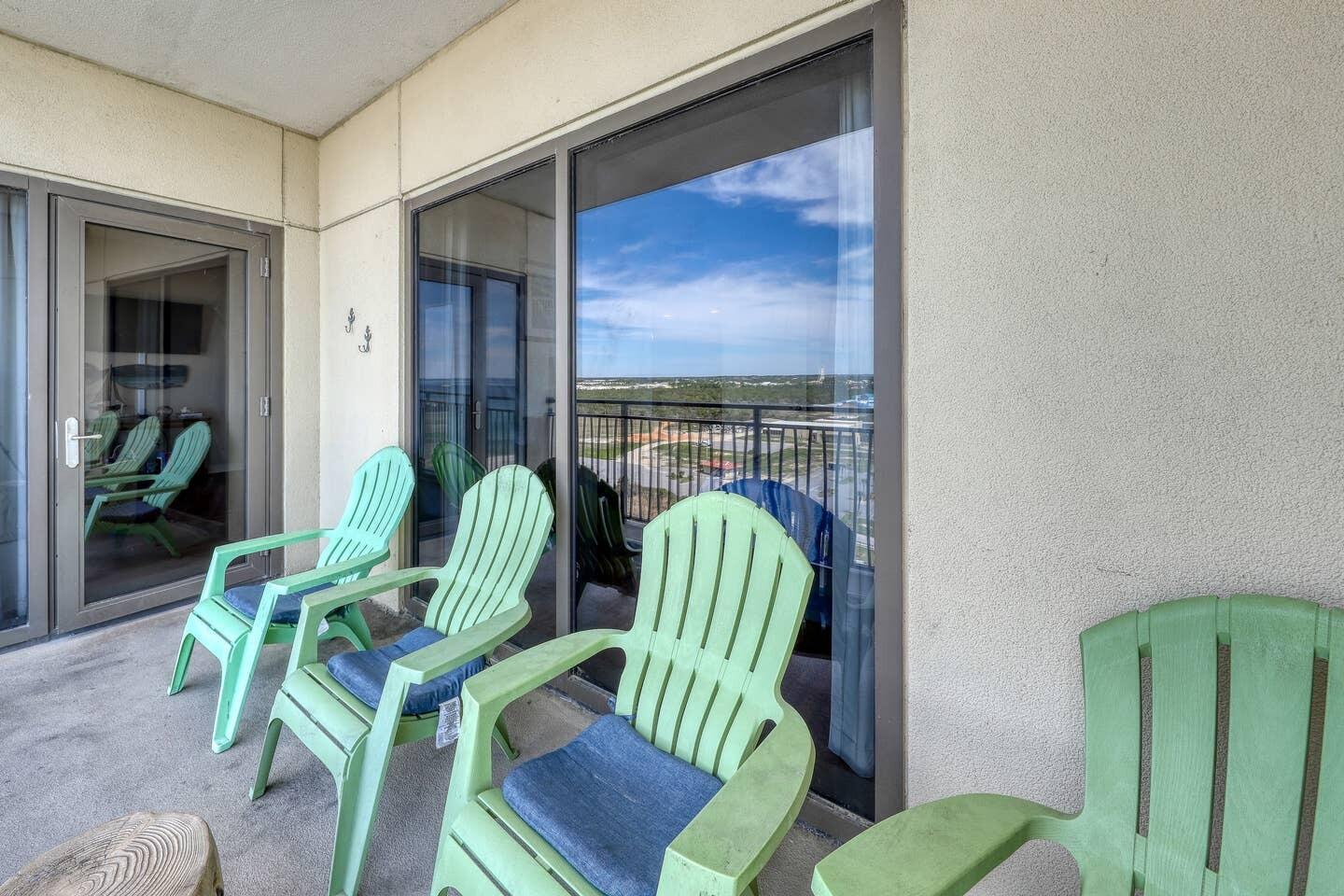 15100 Front Beach Road, Unit 1107 Panama City Beach, FL 32413 - Photo 17 of 24 a view of balcony with two chairs and a potted plant