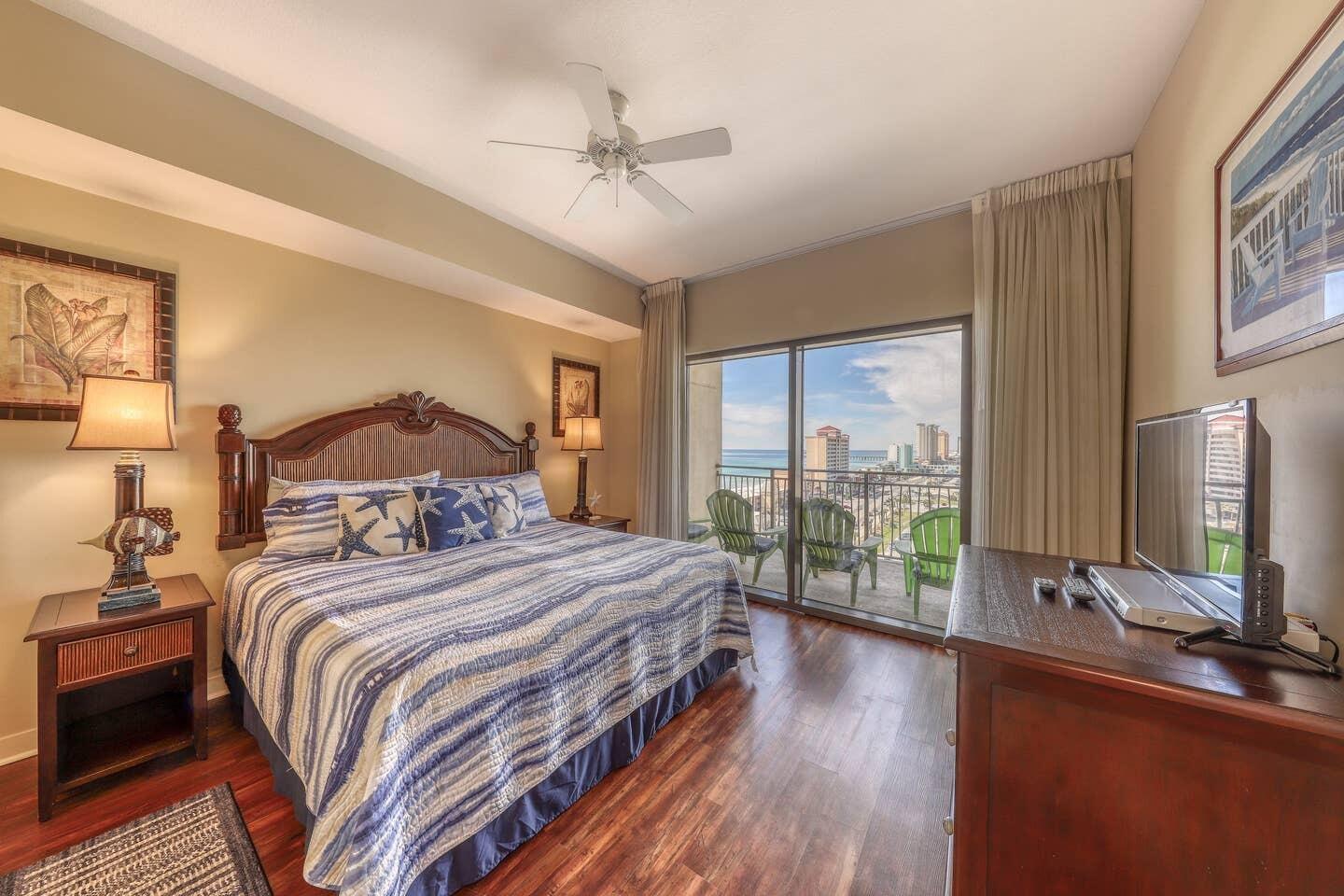 15100 Front Beach Road, Unit 1107 Panama City Beach, FL 32413 - Photo 2 of 24 a bedroom with a large bed and a large window