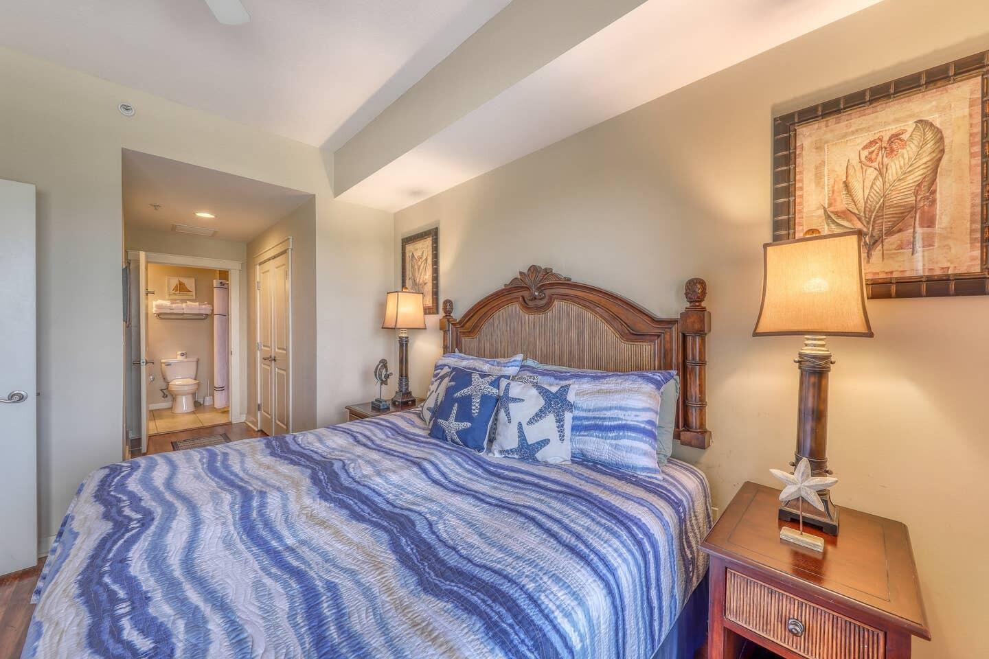 15100 Front Beach Road, Unit 1107 Panama City Beach, FL 32413 - Photo 4 of 24 a bedroom with a bed and wooden floor