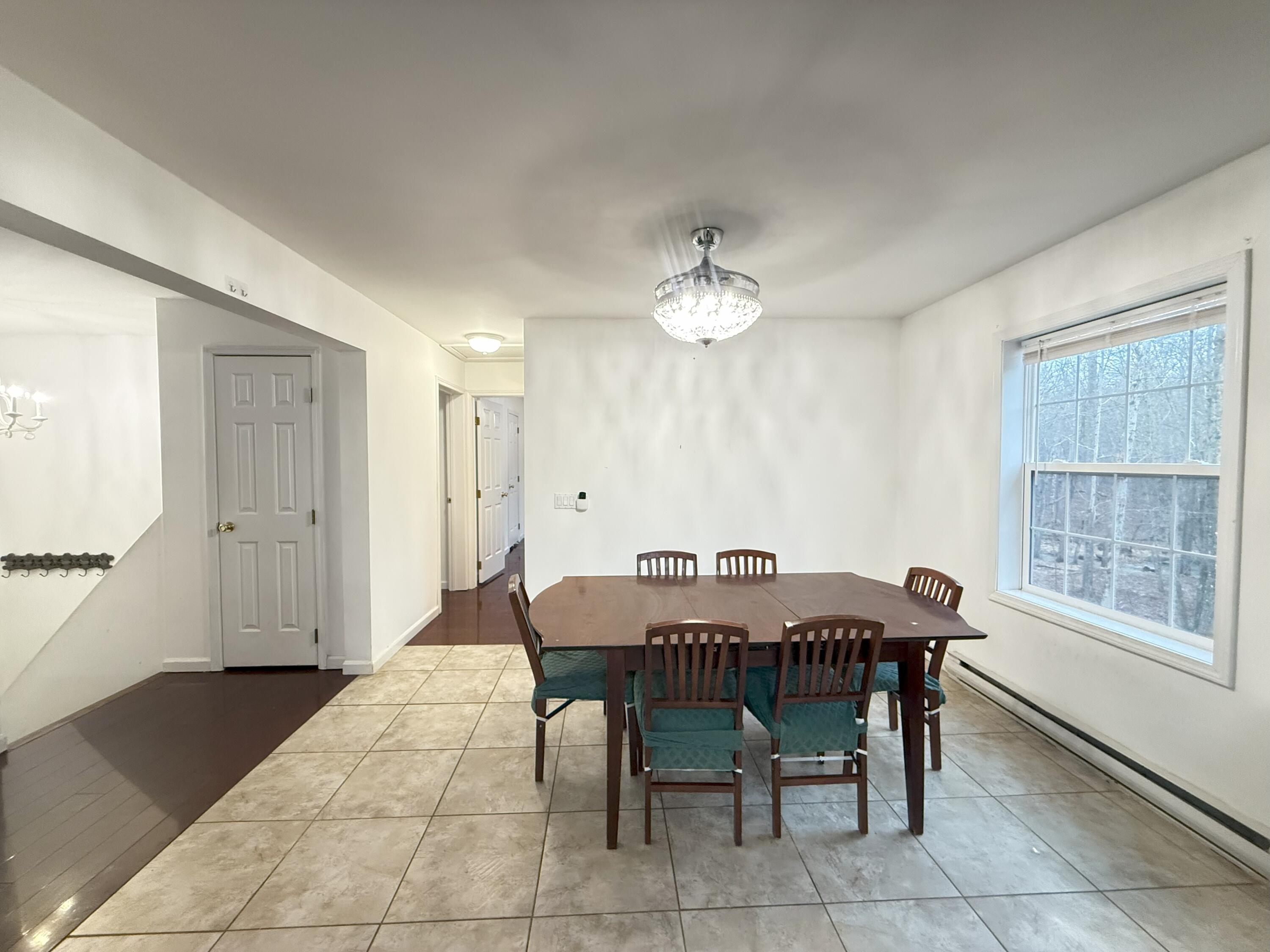 6486 Decker Road Bushkill, PA 18324 - Photo 11 of 53 a view of a dining room with furniture and chandelier