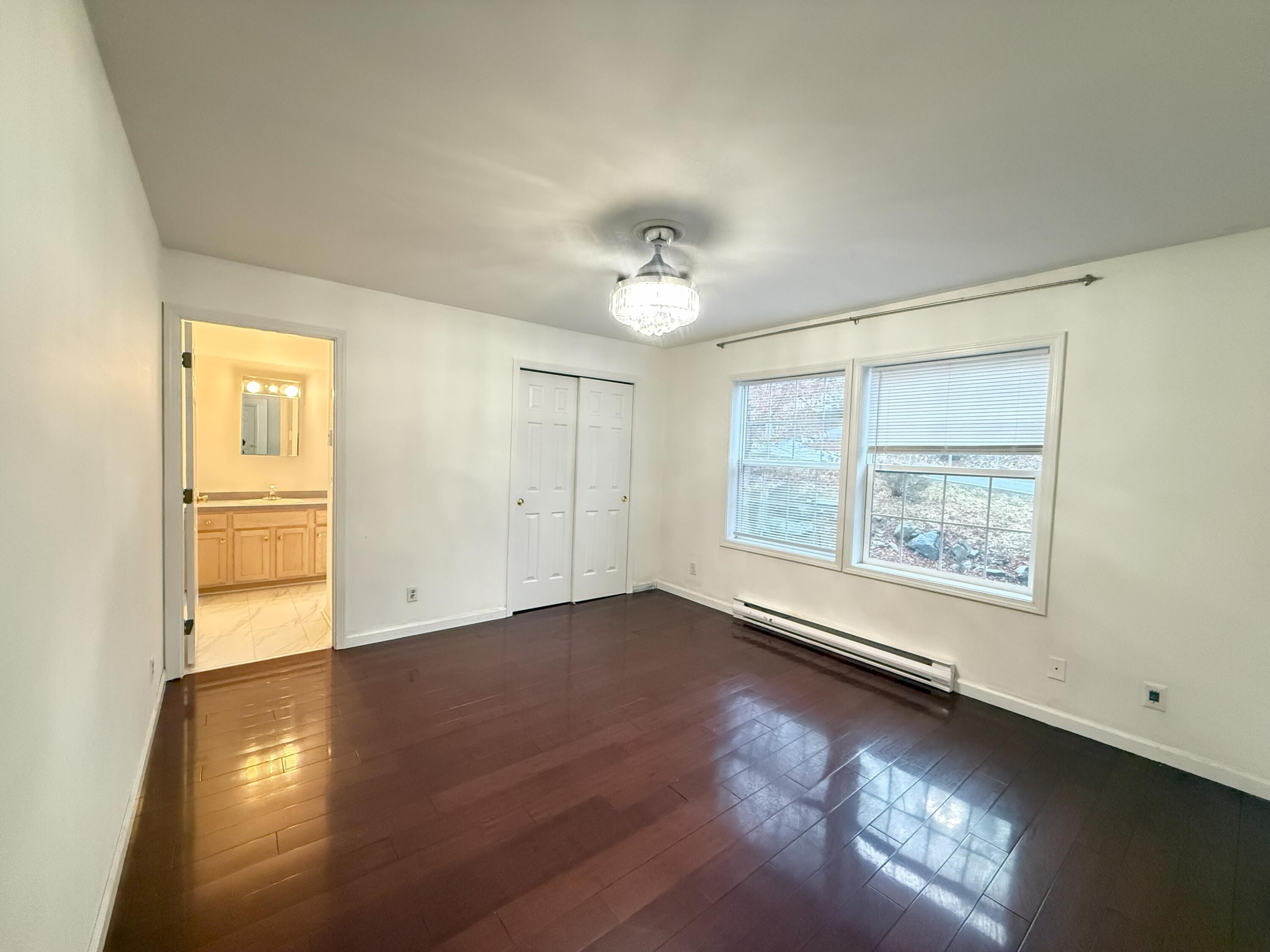 6486 Decker Road Bushkill, PA 18324 - Photo 12 of 53 a view of an empty room with a window and wooden floor