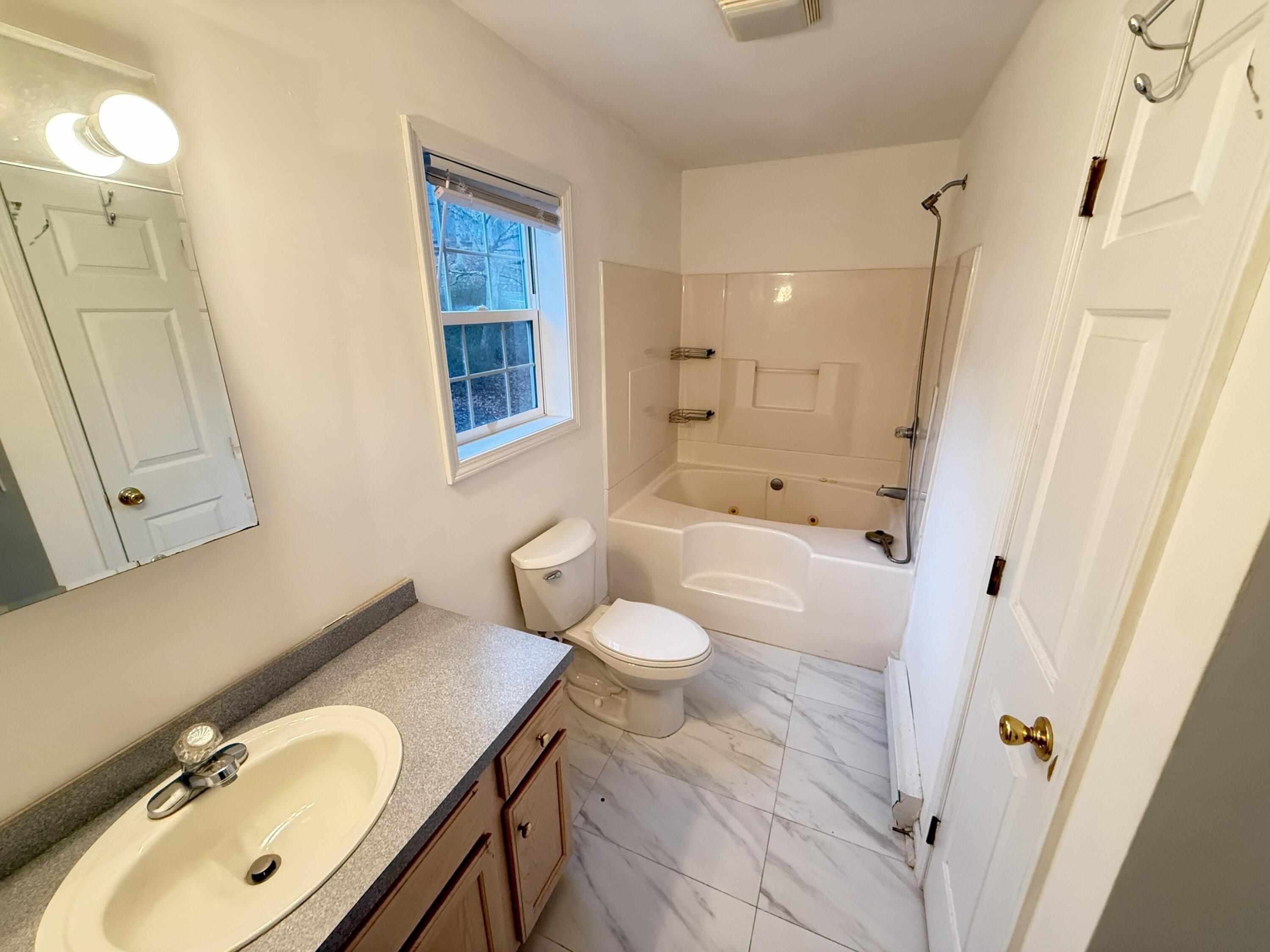 6486 Decker Road Bushkill, PA 18324 - Photo 14 of 53 a bathroom with a sink a toilet and shower