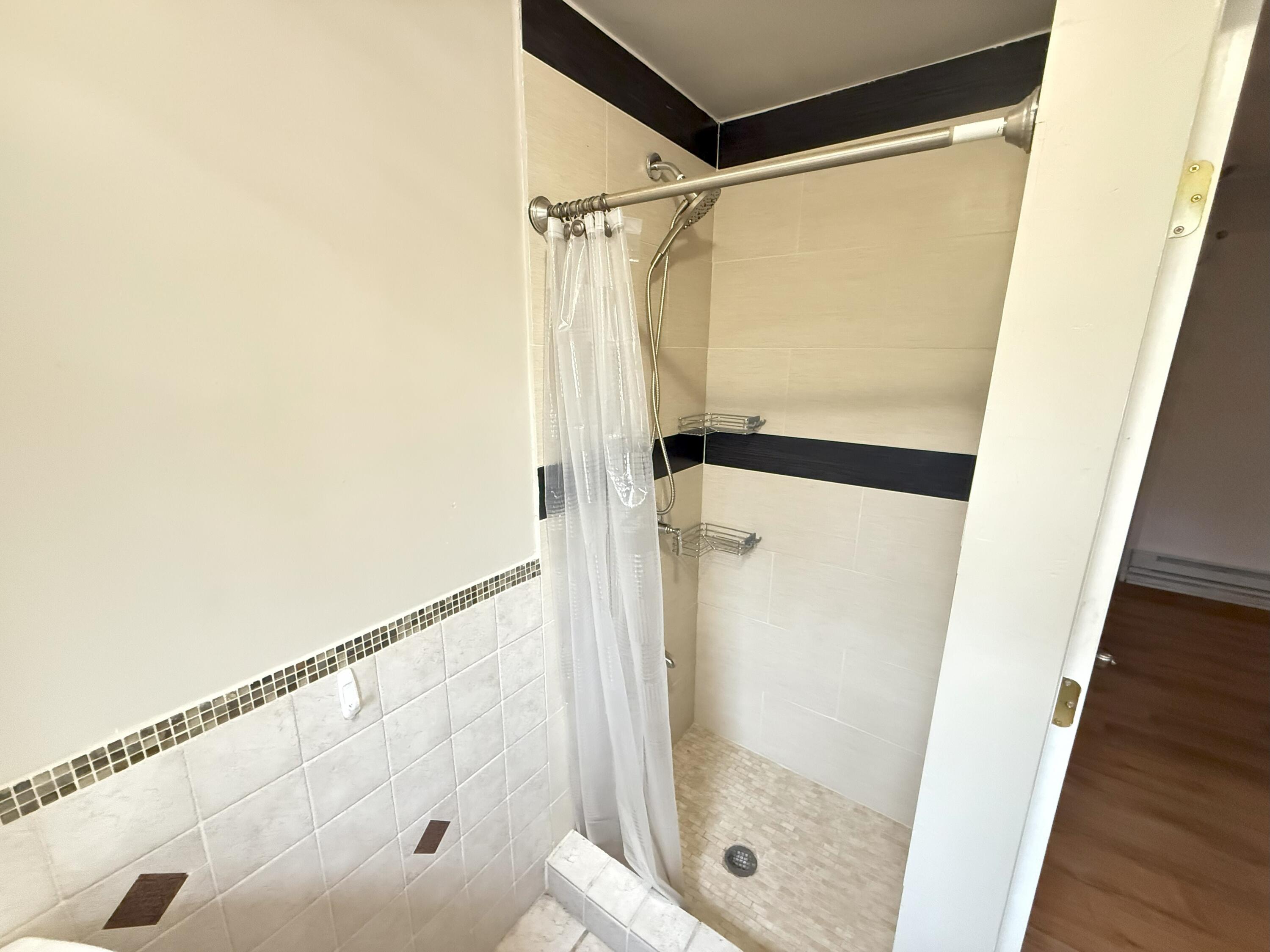 6486 Decker Road Bushkill, PA 18324 - Photo 26 of 53 a bathroom with a glass shower door