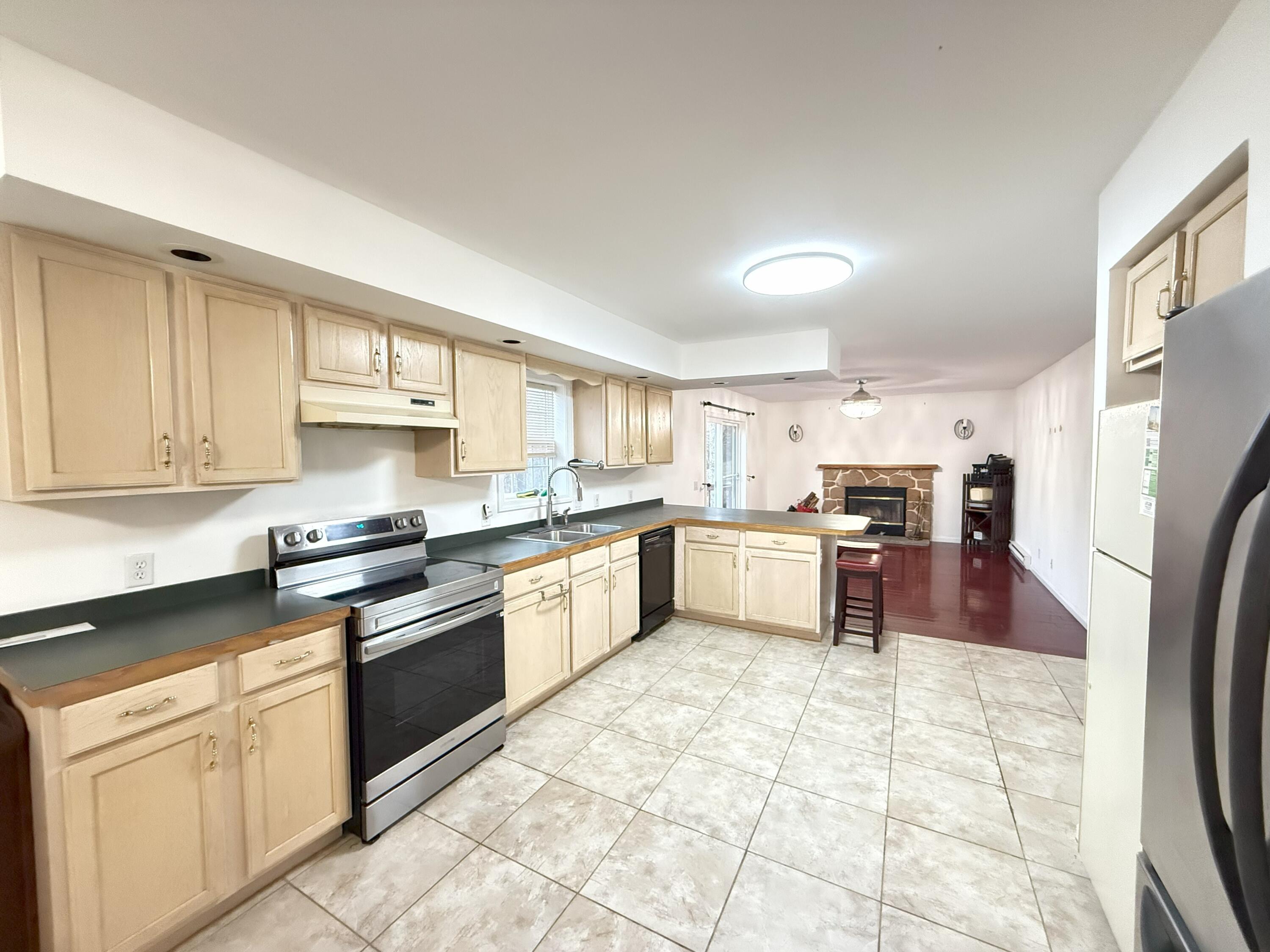 6486 Decker Road Bushkill, PA 18324 - Photo 4 of 53 a large kitchen with cabinets and stainless steel appliances