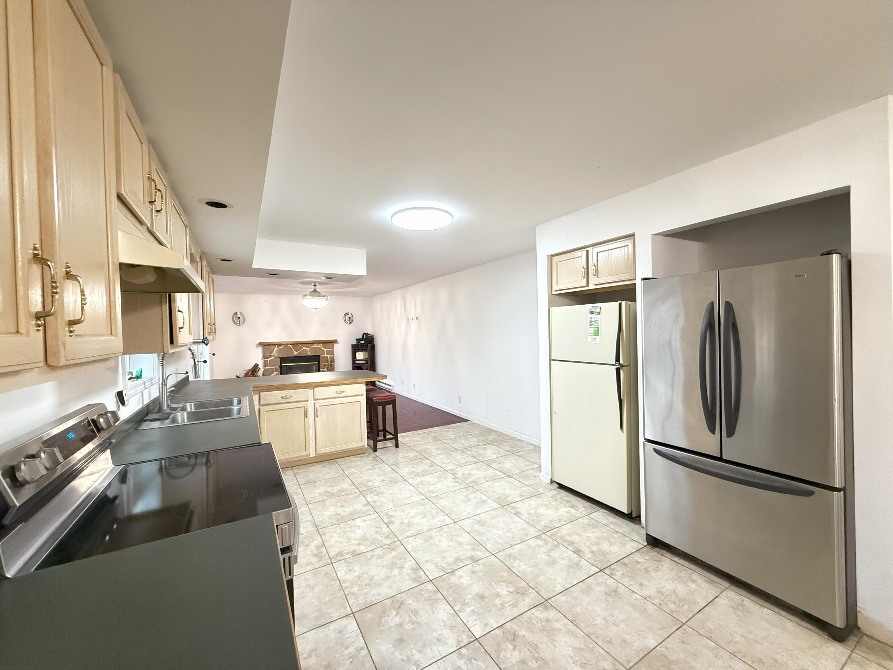 6486 Decker Road Bushkill, PA 18324 - Photo 5 of 53 a kitchen with stainless steel appliances a refrigerator sink and stove