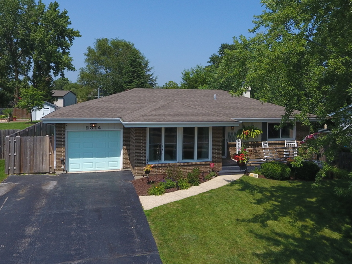 2314 Beck Road Lindenhurst, IL 60046 - Photo 1 of 11 a front view of a house with a garden and patio