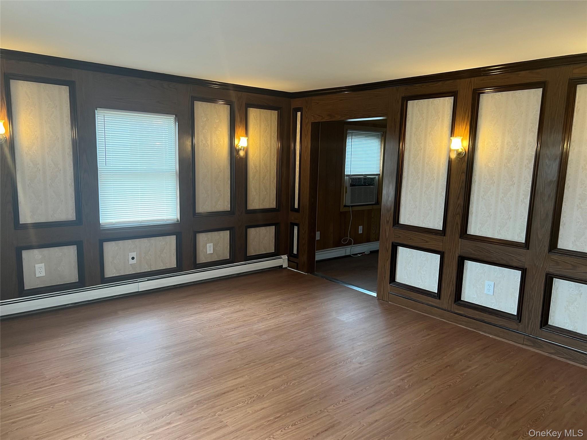8 Gables Road Hicksville, NY 11801 - Photo 3 of 9 wooden floor in an empty room with a window