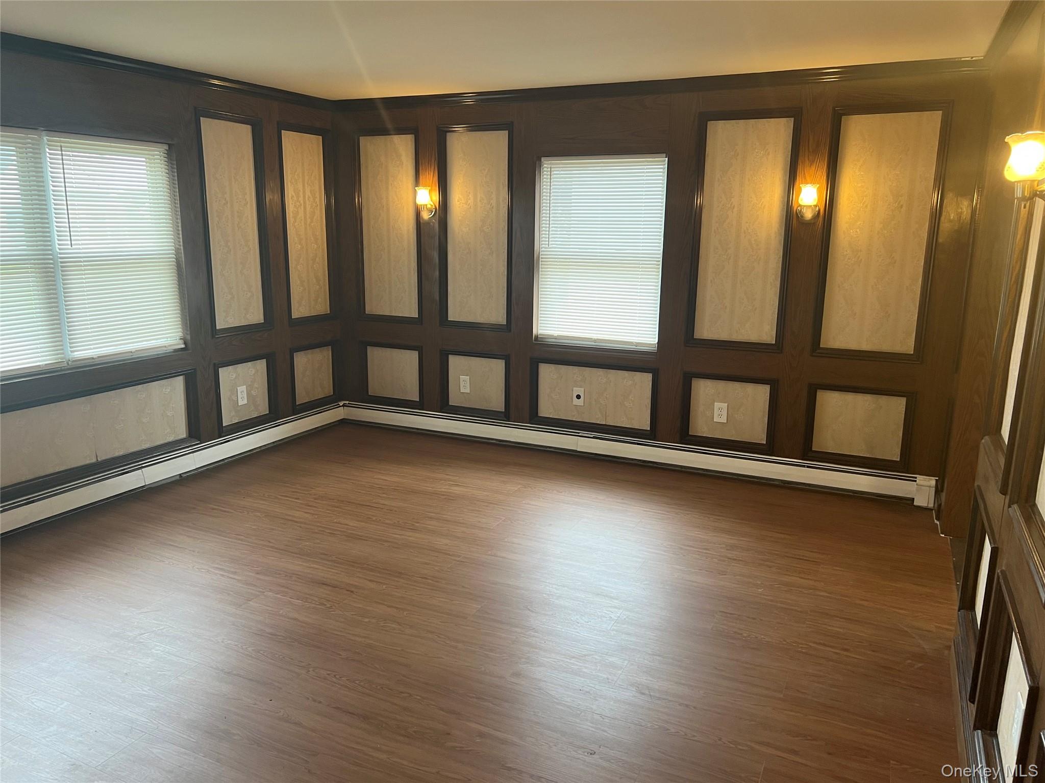 8 Gables Road Hicksville, NY 11801 - Photo 6 of 9 wooden floor in an empty room with a window
