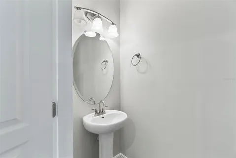 a bathroom with a sink and mirror