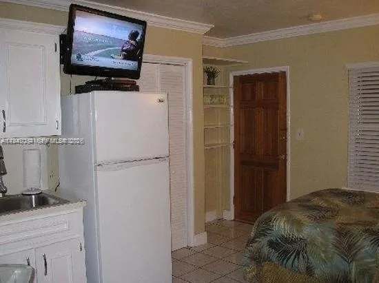 a kitchen with stainless steel appliances granite countertop a sink a stove and cabinets