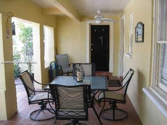 330 Coolidge Street, Unit 2 Hollywood, FL 33019 - Photo 5 of 7 a view of a dining room with furniture and window