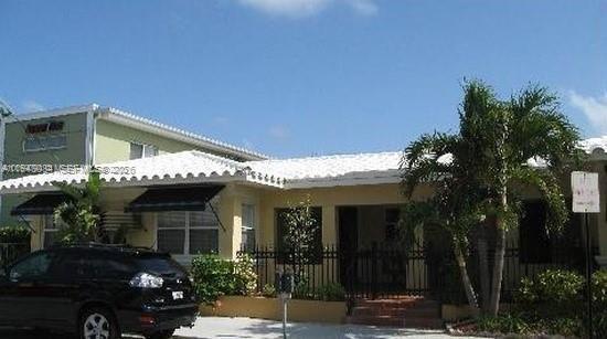 330 Coolidge Street, Unit 2 Hollywood, FL 33019 - Photo 6 of 7 a front view of a house with plants