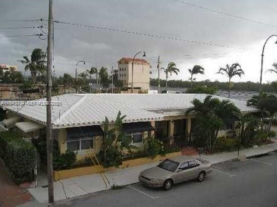 330 Coolidge Street, Unit 2 Hollywood, FL 33019 - Photo 7 of 7 a car parked in front of house
