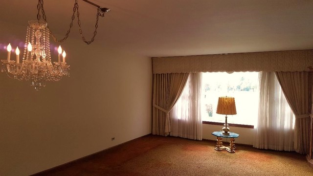 7620 West 25th Street North Riverside, IL 60546 - Photo 11 of 33 a view of a room with windows and chandelier