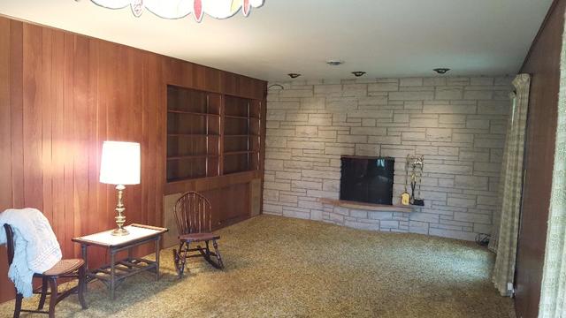 7620 West 25th Street North Riverside, IL 60546 - Photo 14 of 33 a room with a chair and a fireplace