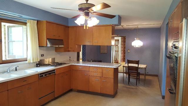 7620 West 25th Street North Riverside, IL 60546 - Photo 17 of 33 a kitchen with a sink cabinets and window