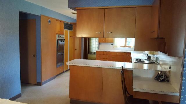 7620 West 25th Street North Riverside, IL 60546 - Photo 19 of 33 a kitchen with granite countertop a refrigerator and a sink
