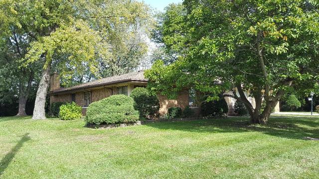 7620 West 25th Street North Riverside, IL 60546 - Photo 3 of 33 a backyard of a house with lots of plants and tree