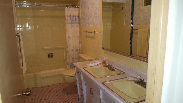 7620 West 25th Street North Riverside, IL 60546 - Photo 24 of 33 a bathroom with a granite countertop sink toilet and shower