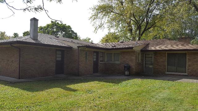 7620 West 25th Street North Riverside, IL 60546 - Photo 5 of 33 a front view of a house with a yard