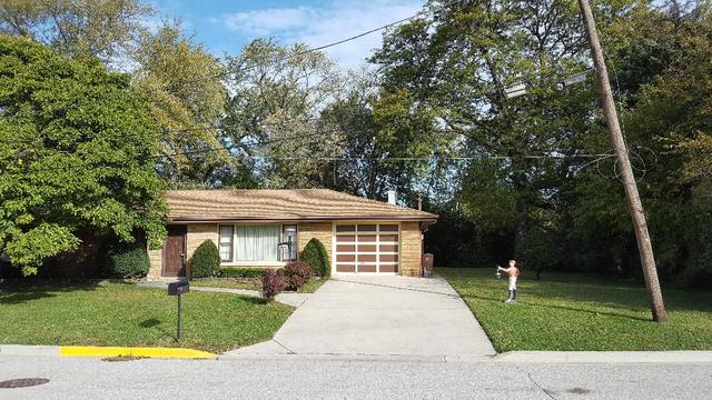 7620 West 25th Street North Riverside, IL 60546 - Photo 7 of 33 front view of a house with a yard