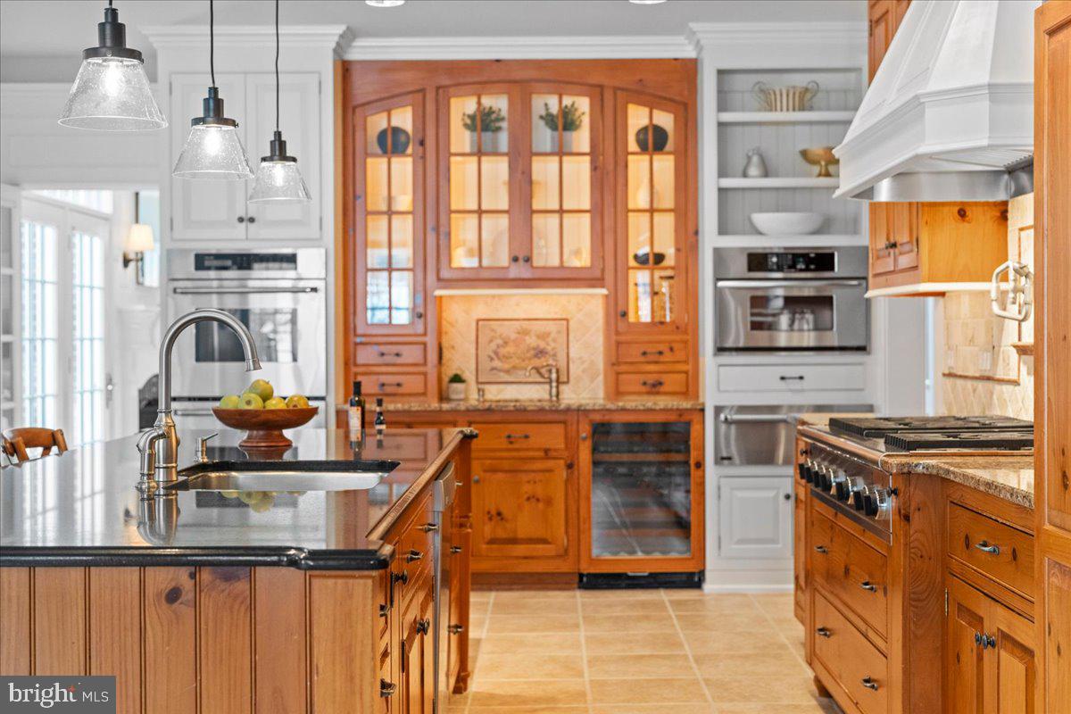 1568 Sacketts Ford Road Ivyland, PA 18974 - Photo 14 of 100 a kitchen with stainless steel appliances granite countertop a stove and a refrigerator