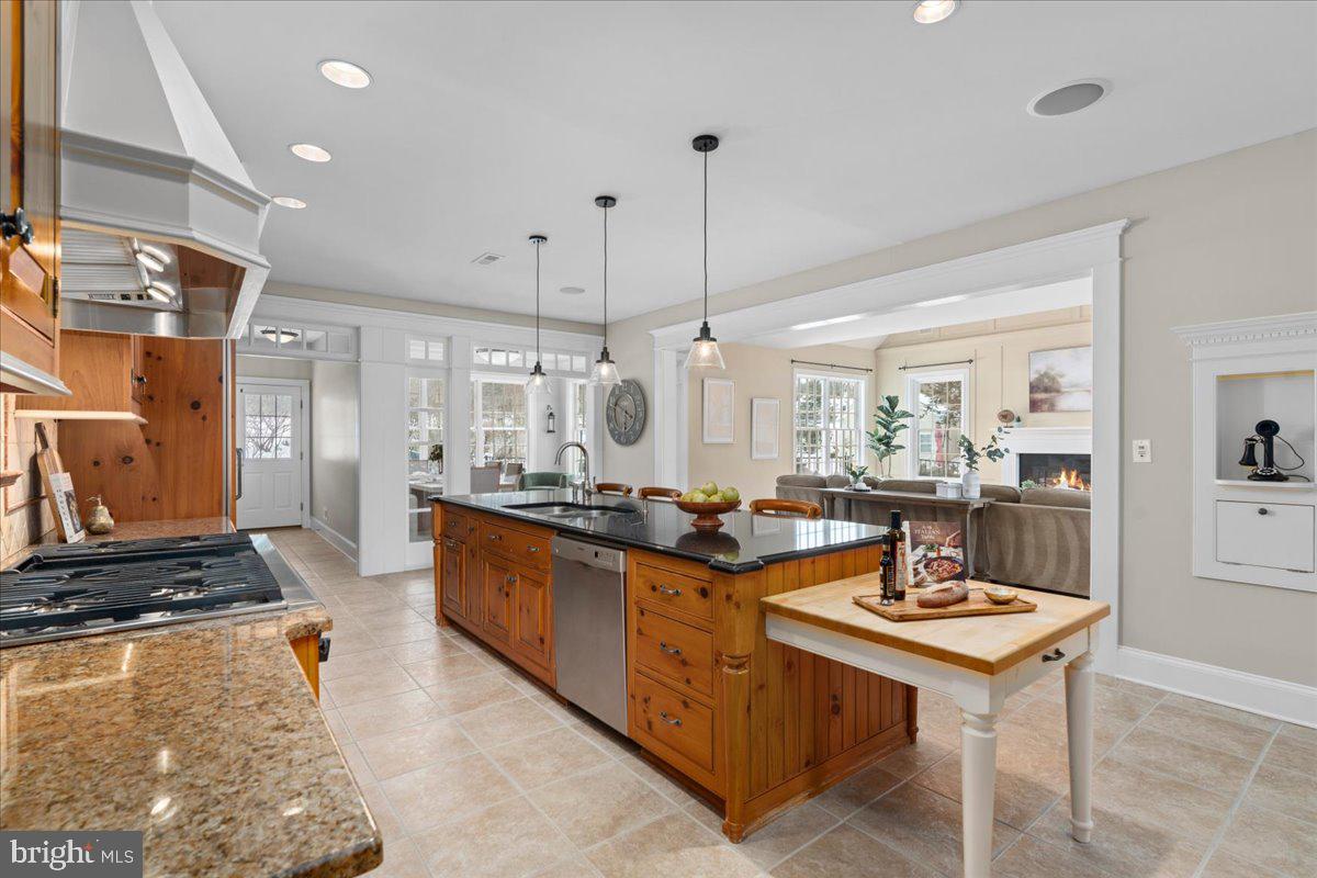 1568 Sacketts Ford Road Ivyland, PA 18974 - Photo 16 of 100 a kitchen with stainless steel appliances granite countertop a stove a sink a refrigerator and chairs