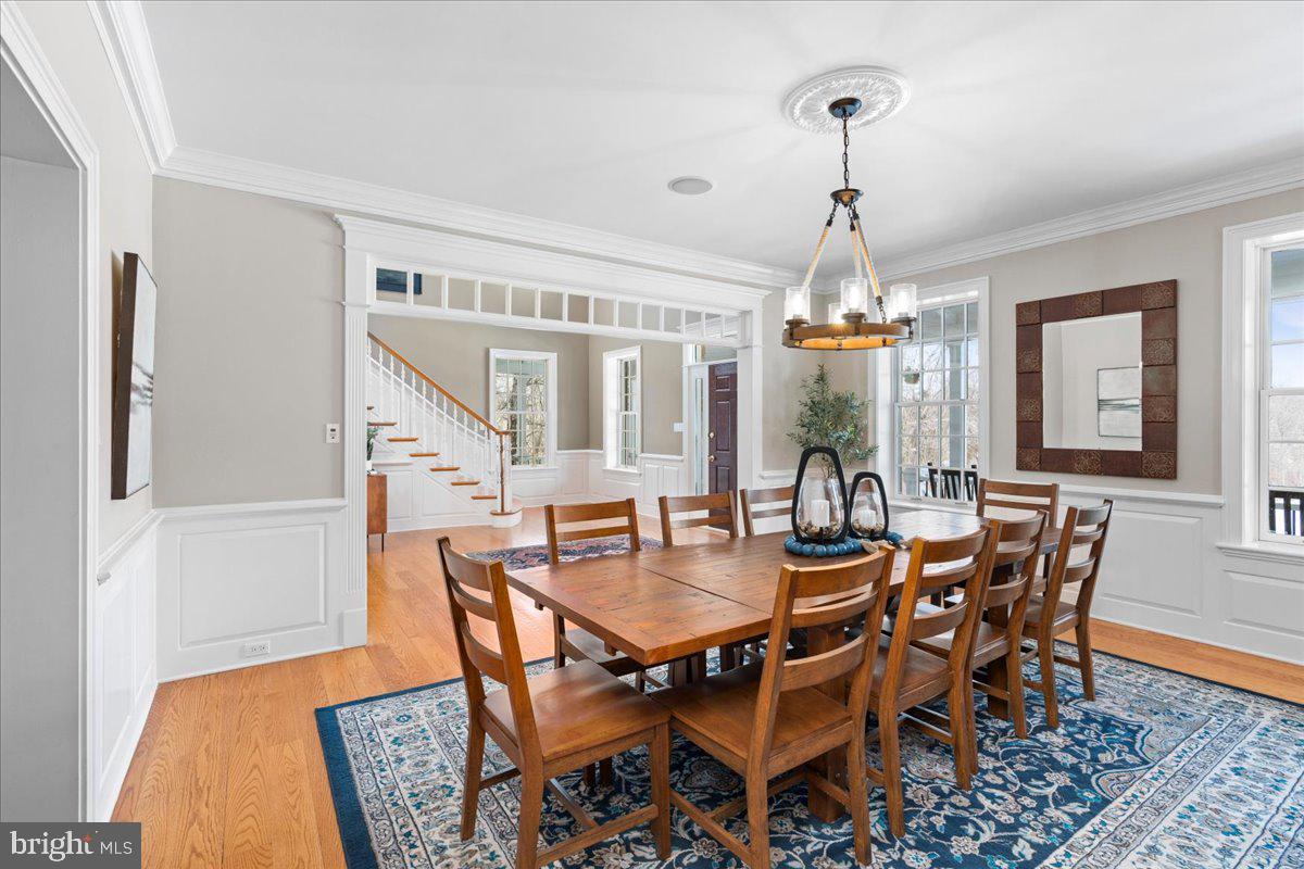 1568 Sacketts Ford Road Ivyland, PA 18974 - Photo 34 of 100 a view of a dining room with furniture and wooden floor