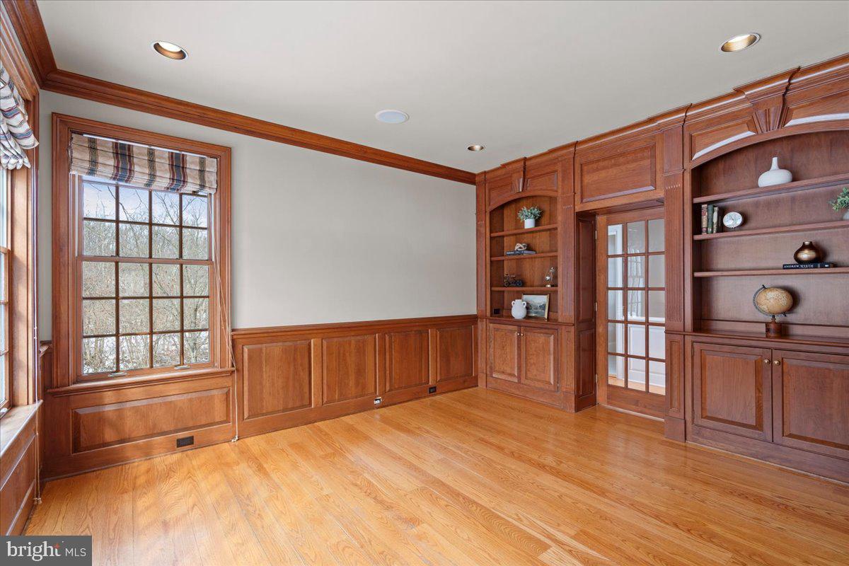 1568 Sacketts Ford Road Ivyland, PA 18974 - Photo 38 of 100 a view of an empty room with window and wooden floor