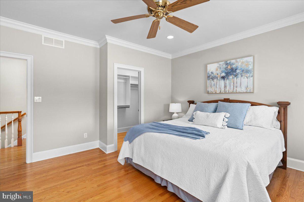 1568 Sacketts Ford Road Ivyland, PA 18974 - Photo 57 of 100 a bedroom with bed and a chandelier