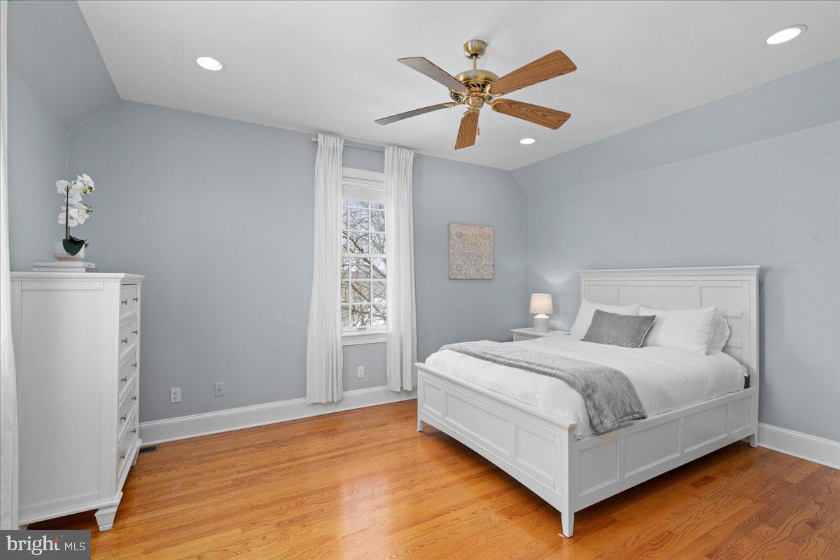 1568 Sacketts Ford Road Ivyland, PA 18974 - Photo 60 of 100 a bedroom with a large bed and a chandelier