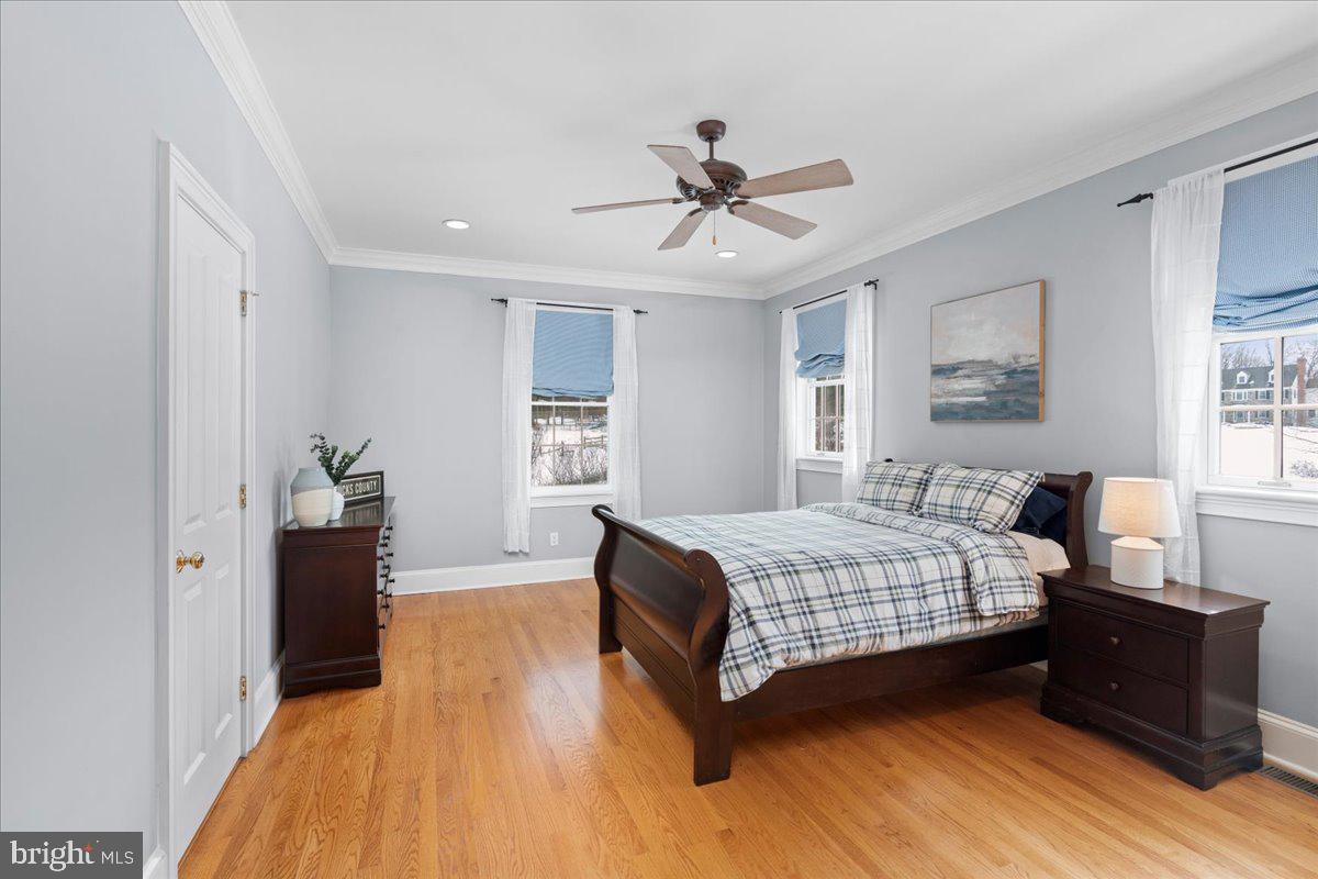 1568 Sacketts Ford Road Ivyland, PA 18974 - Photo 65 of 100 a bedroom with a bed and wooden floor