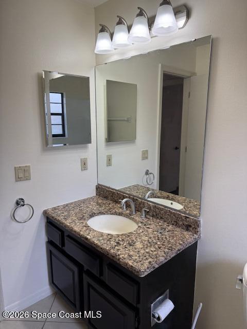 810 Ridge Lake Drive Melbourne, FL 32940 - Photo 12 of 25 a bathroom with a granite countertop sink and a mirror