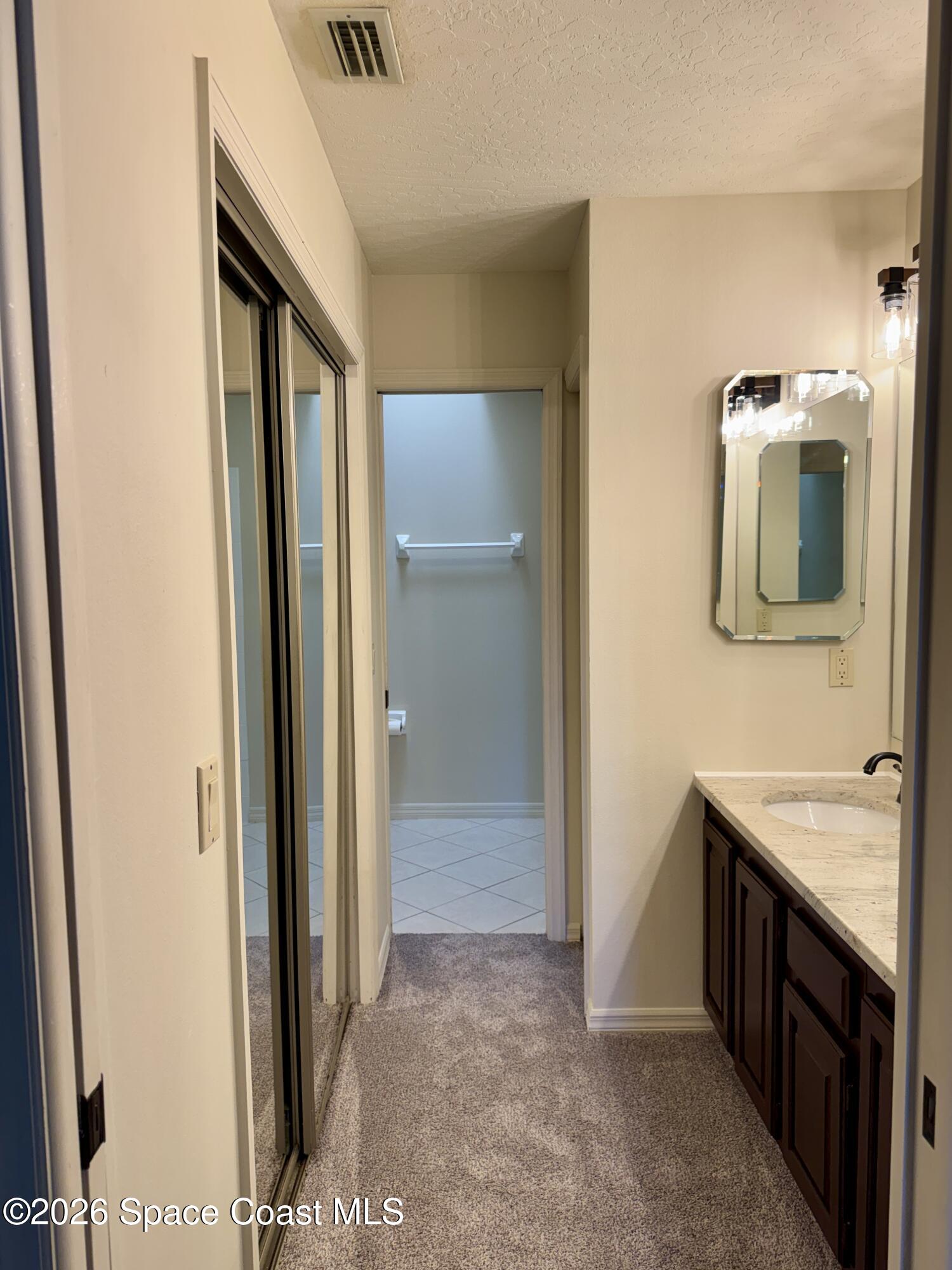 810 Ridge Lake Drive Melbourne, FL 32940 - Photo 16 of 25 a view of a bathroom from the hallway