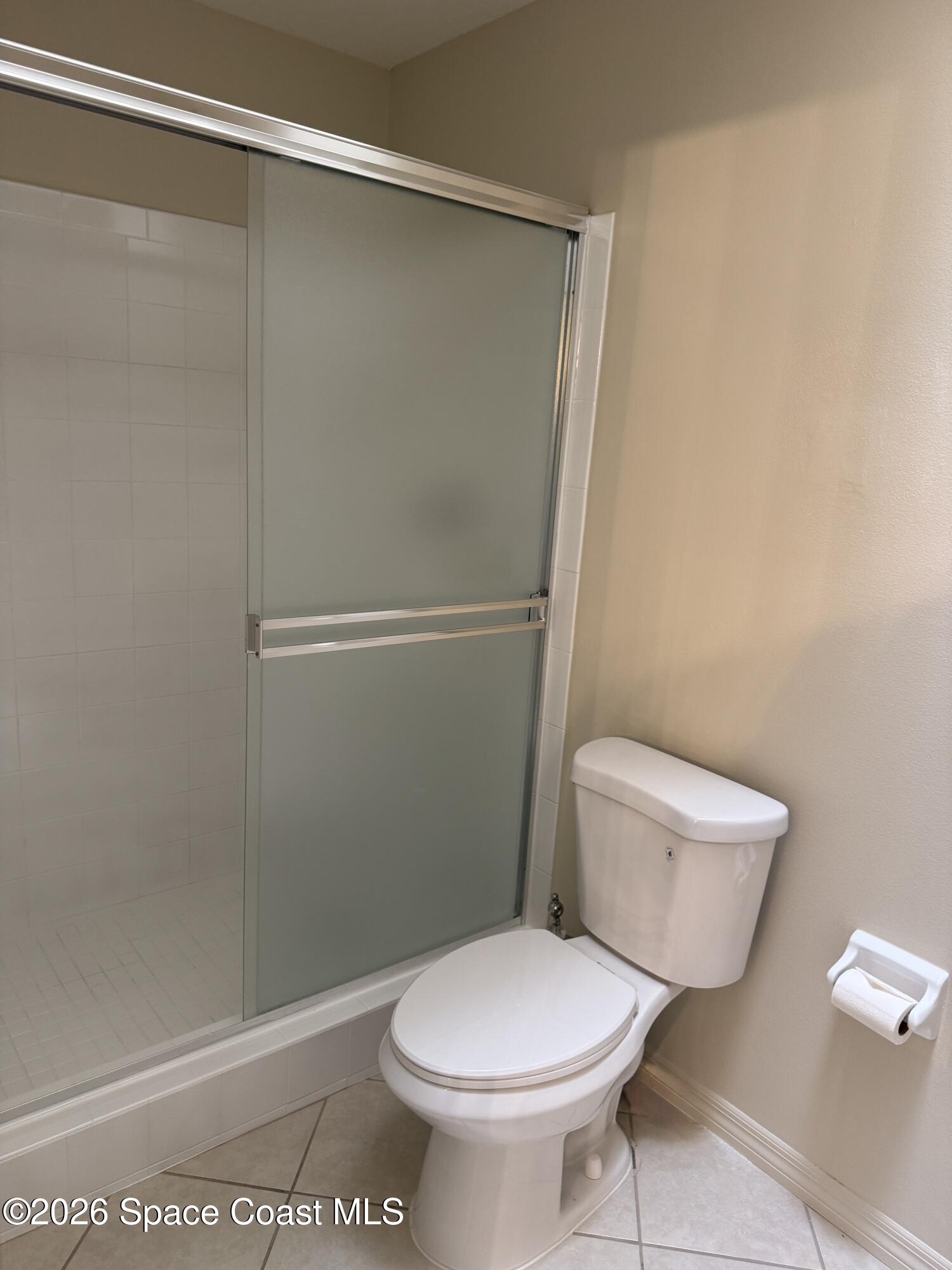 810 Ridge Lake Drive Melbourne, FL 32940 - Photo 19 of 25 a white toilet sitting next to a shower