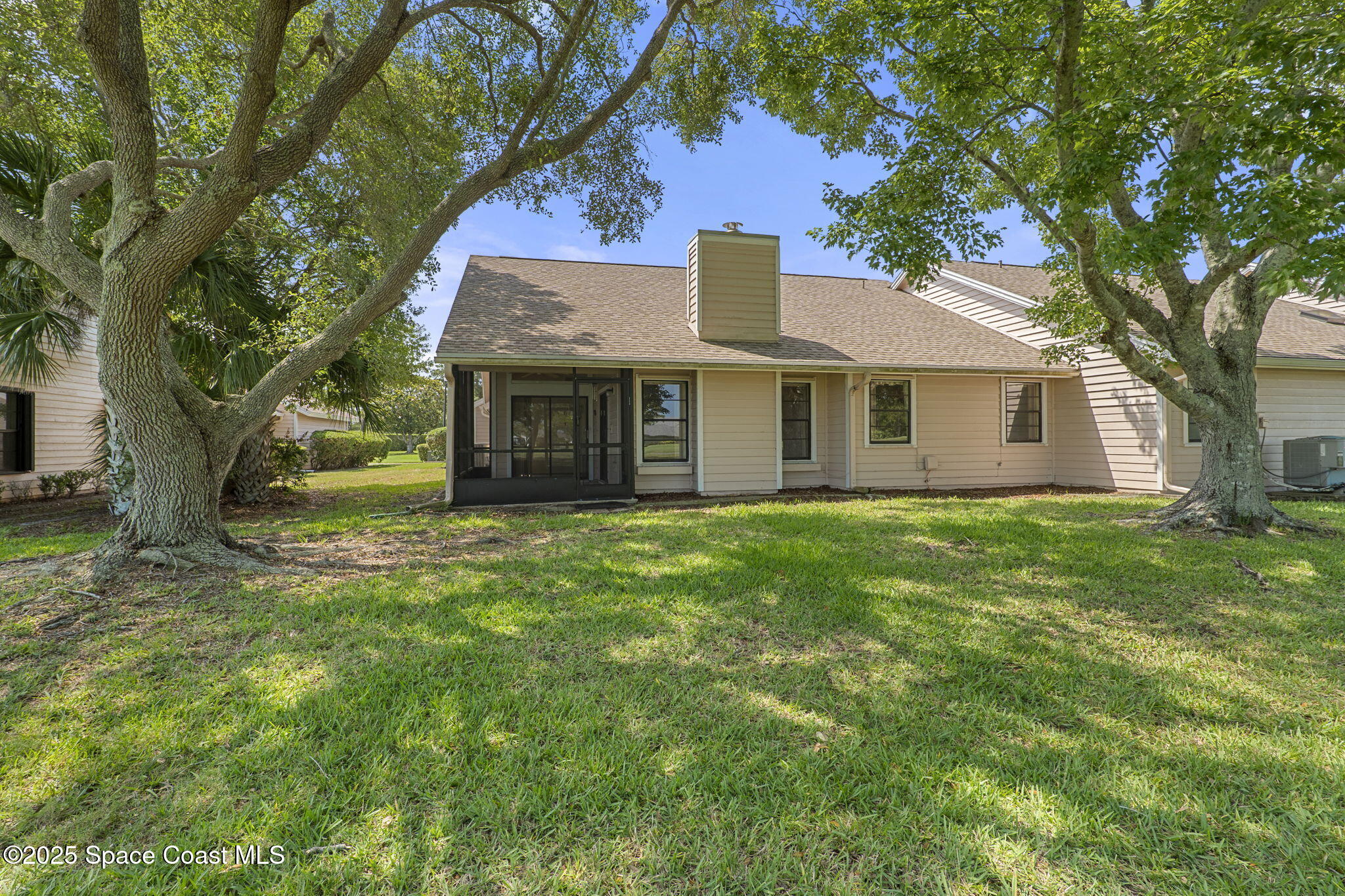 810 Ridge Lake Drive Melbourne, FL 32940 - Photo 22 of 25 a front view of a house with a garden