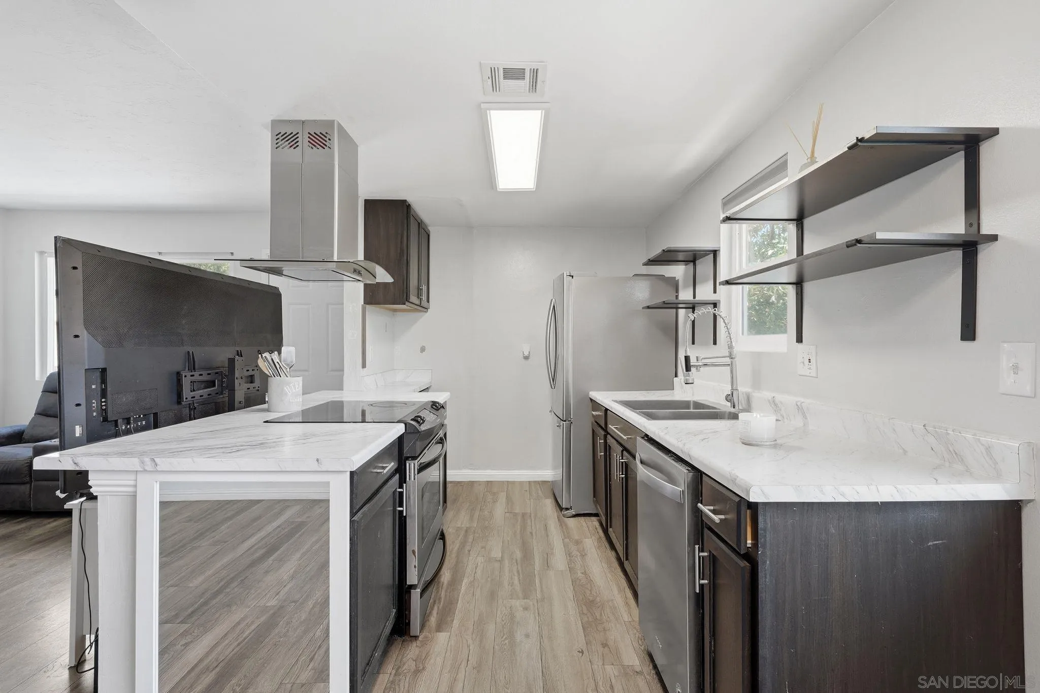 9926 Mission Vega Road, Unit 4 Santee, CA 92071 - Photo 13 of 30 a kitchen with a sink a stove and a refrigerator