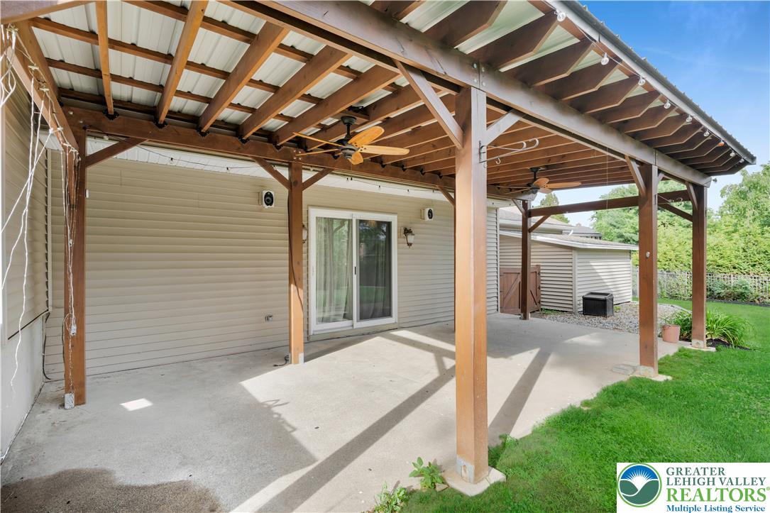 3396 Darien Road Bethlehem, PA 18020 - Photo 42 of 44 A spacious concrete patio under a wooden pergola offers a perfect outdoor entertaining space.