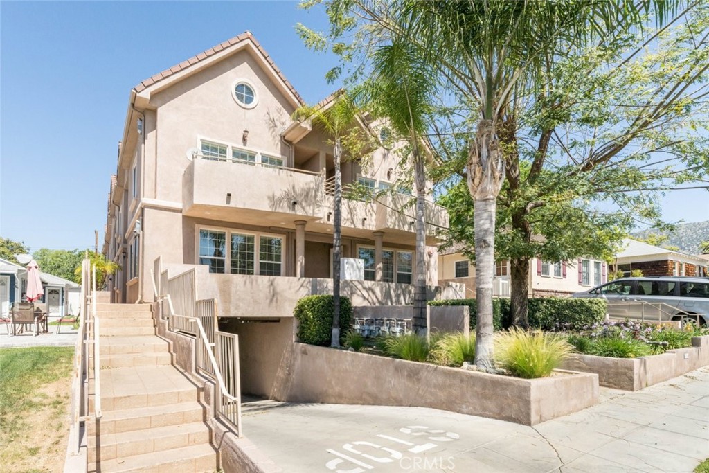 511 East Harvard Road, Unit 101 Burbank, CA 91501 - Photo 2 of 29 a view of a building with a garden and pathway
