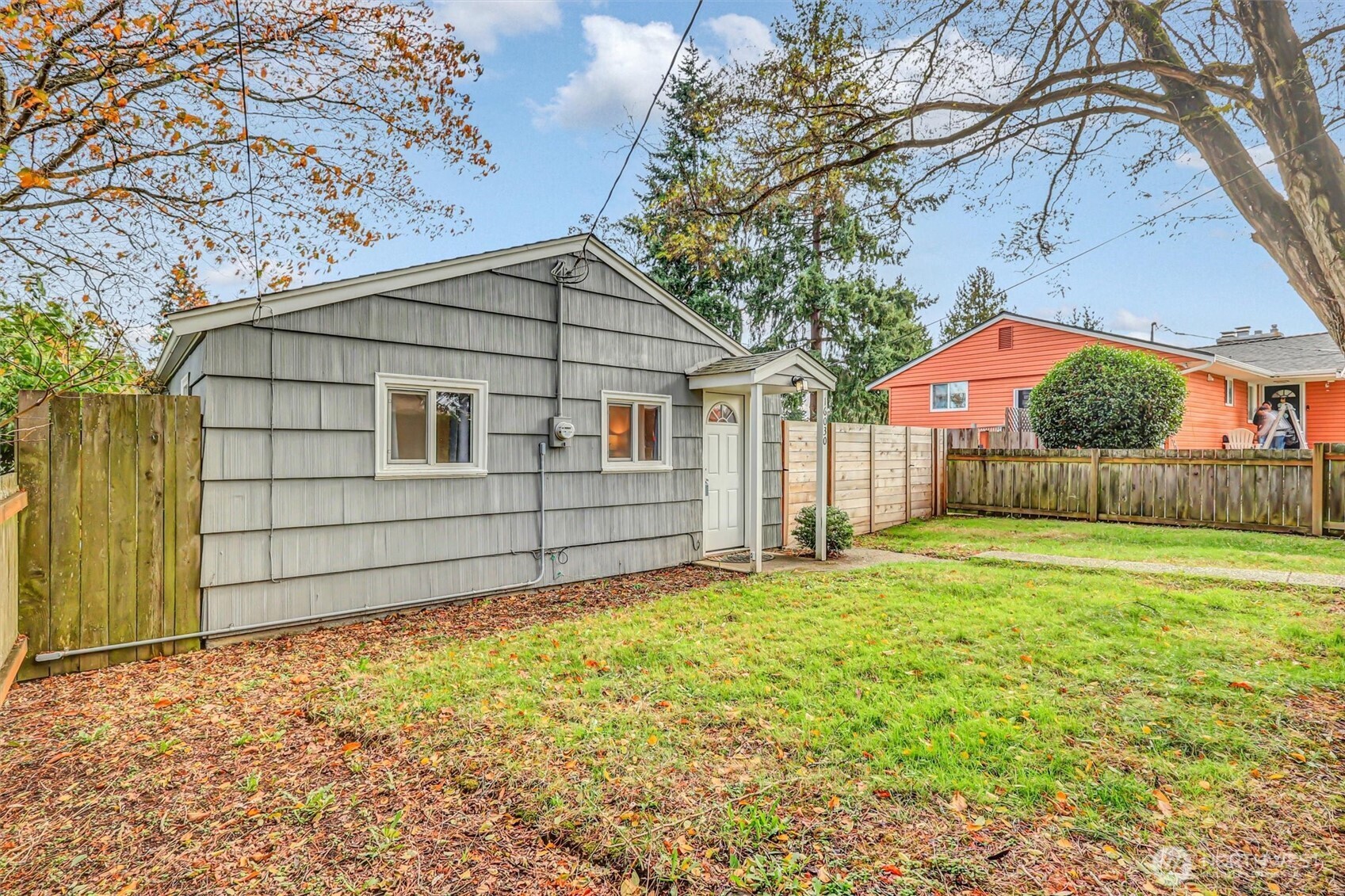 16030 15th Avenue Southwest Burien, WA 98166 - Photo 13 of 19 a view of a house with a yard and garage