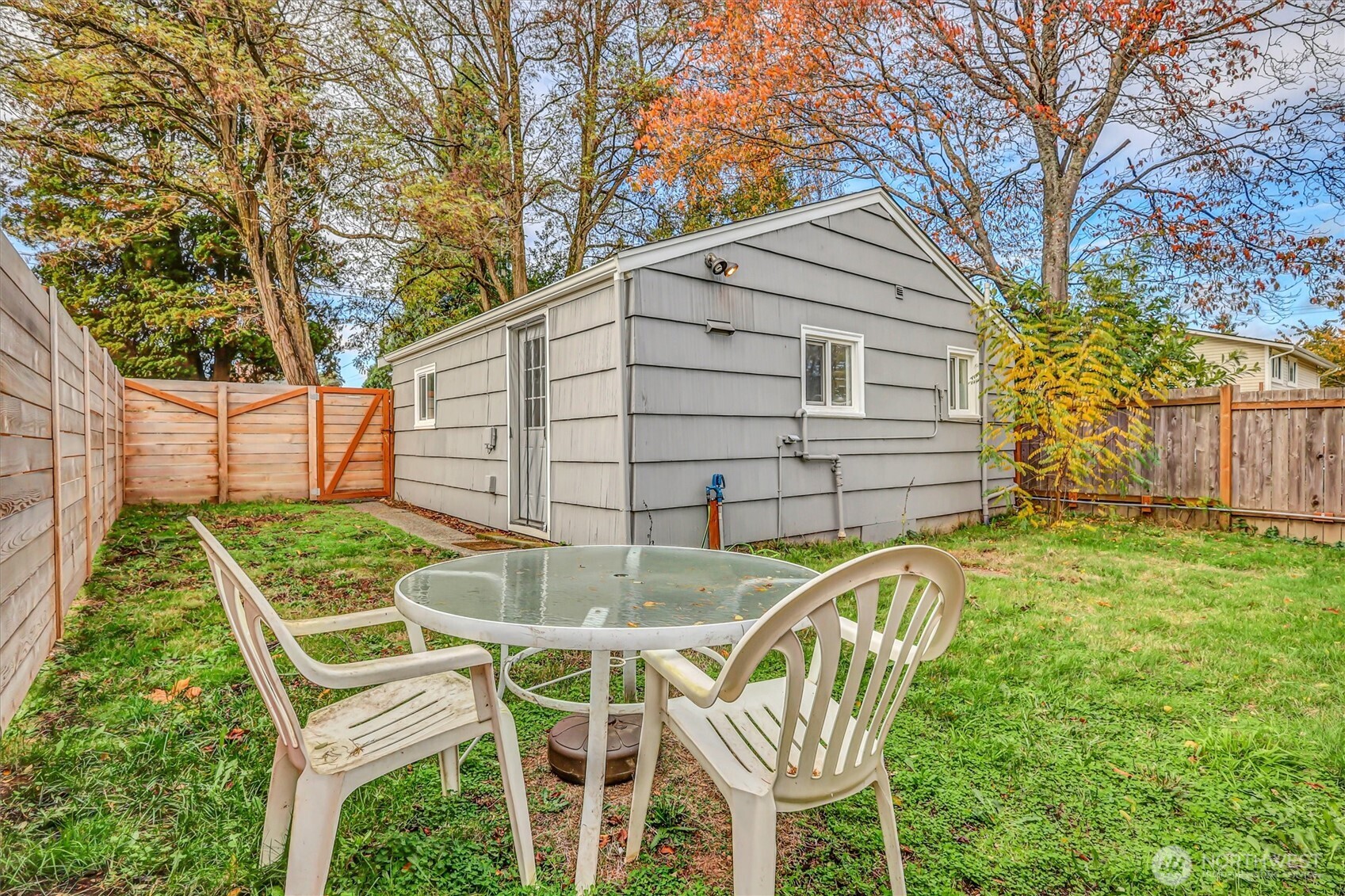 16030 15th Avenue Southwest Burien, WA 98166 - Photo 14 of 19 a backyard of a house with table and chairs