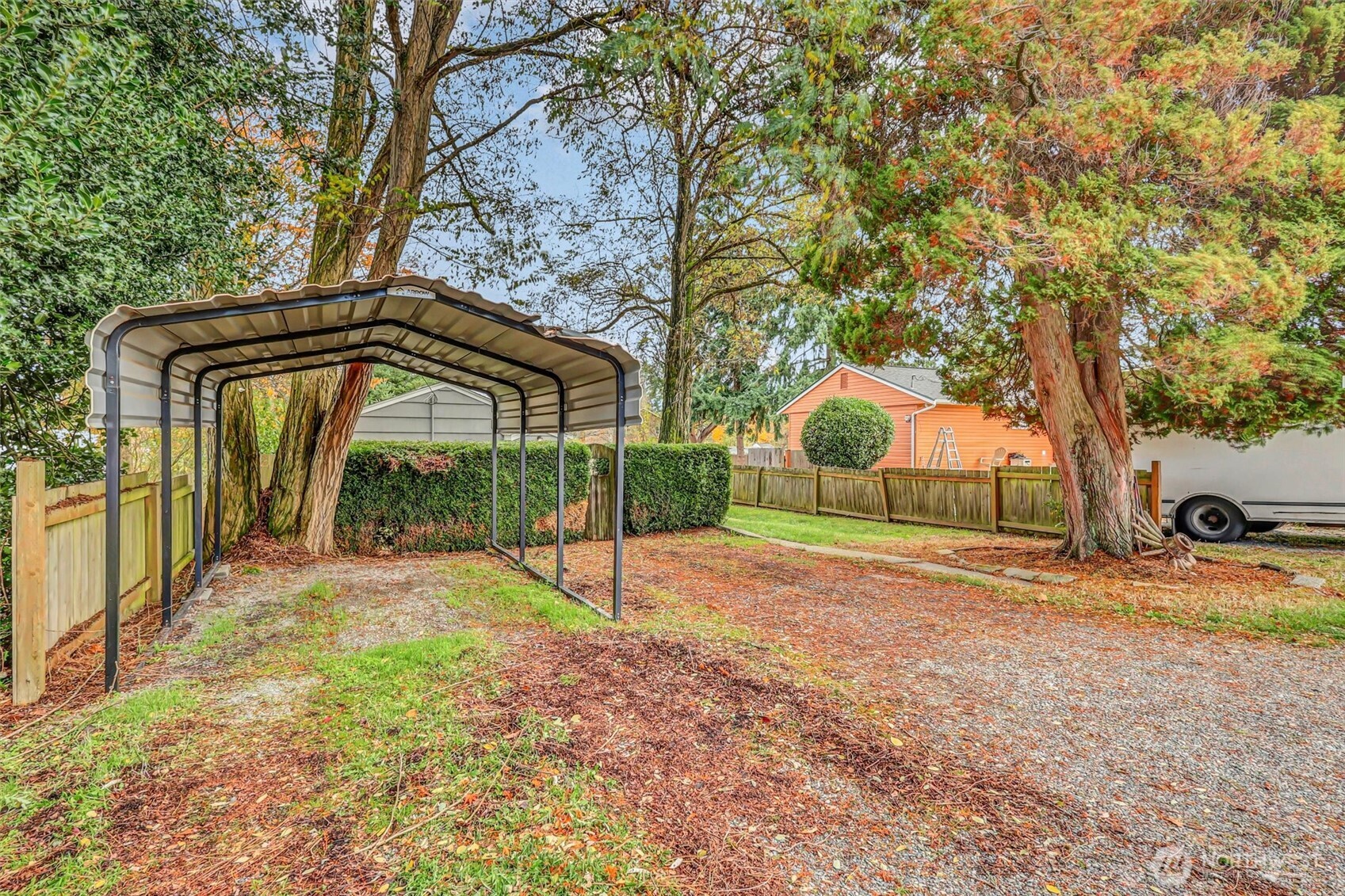 16030 15th Avenue Southwest Burien, WA 98166 - Photo 2 of 19 a backyard of a house with childrens swings and slides