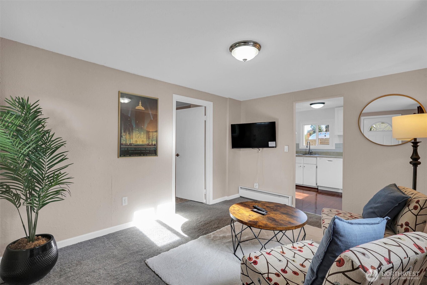 16030 15th Avenue Southwest Burien, WA 98166 - Photo 3 of 19 a living room with furniture and a flat screen tv