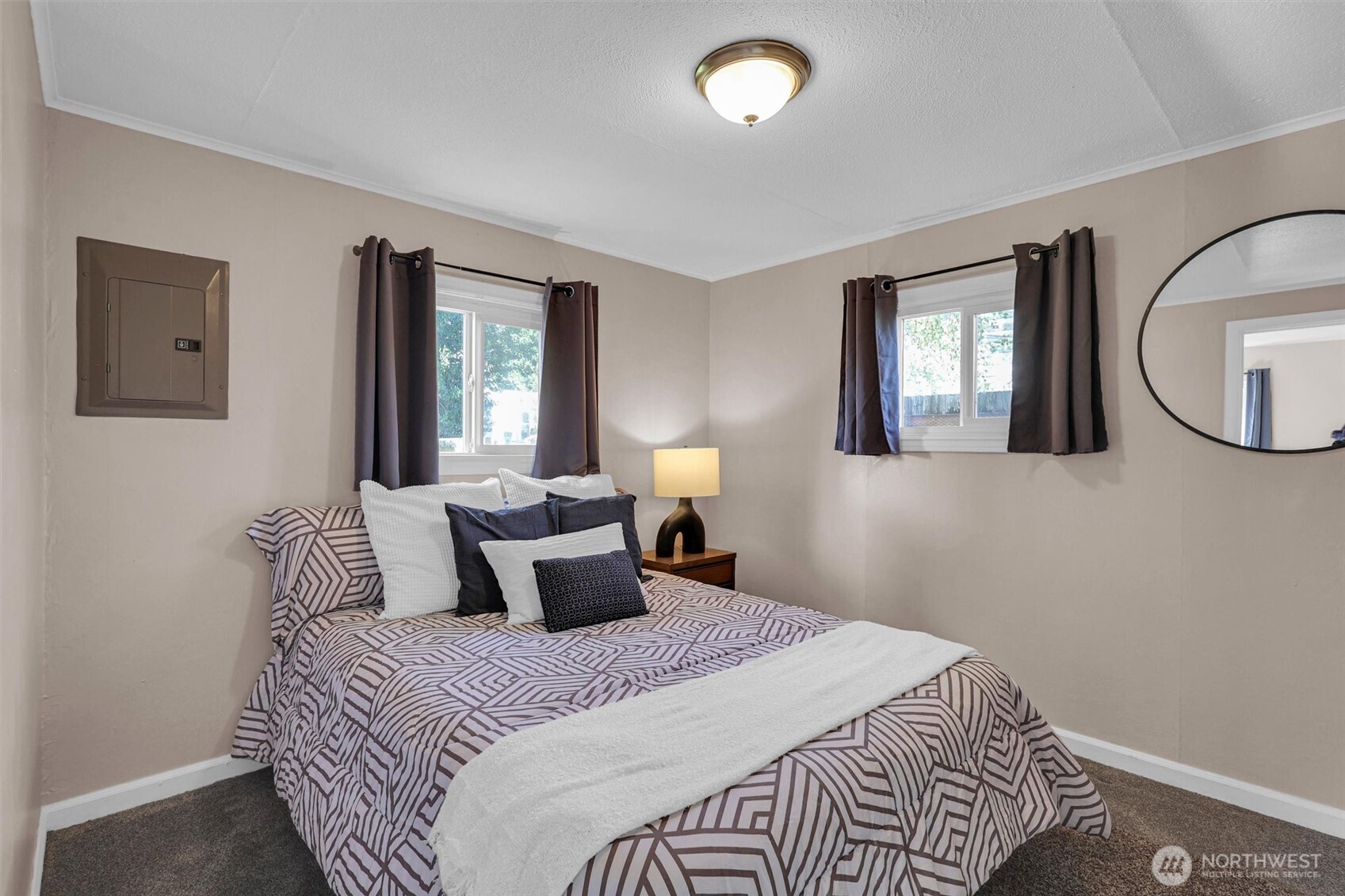 16030 15th Avenue Southwest Burien, WA 98166 - Photo 7 of 19 a bedroom with a large bed and a window