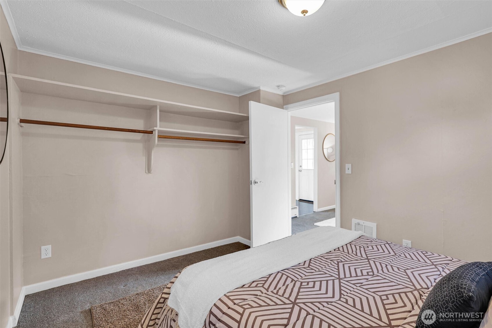 16030 15th Avenue Southwest Burien, WA 98166 - Photo 8 of 19 a bedroom with a bed and a walk in closet