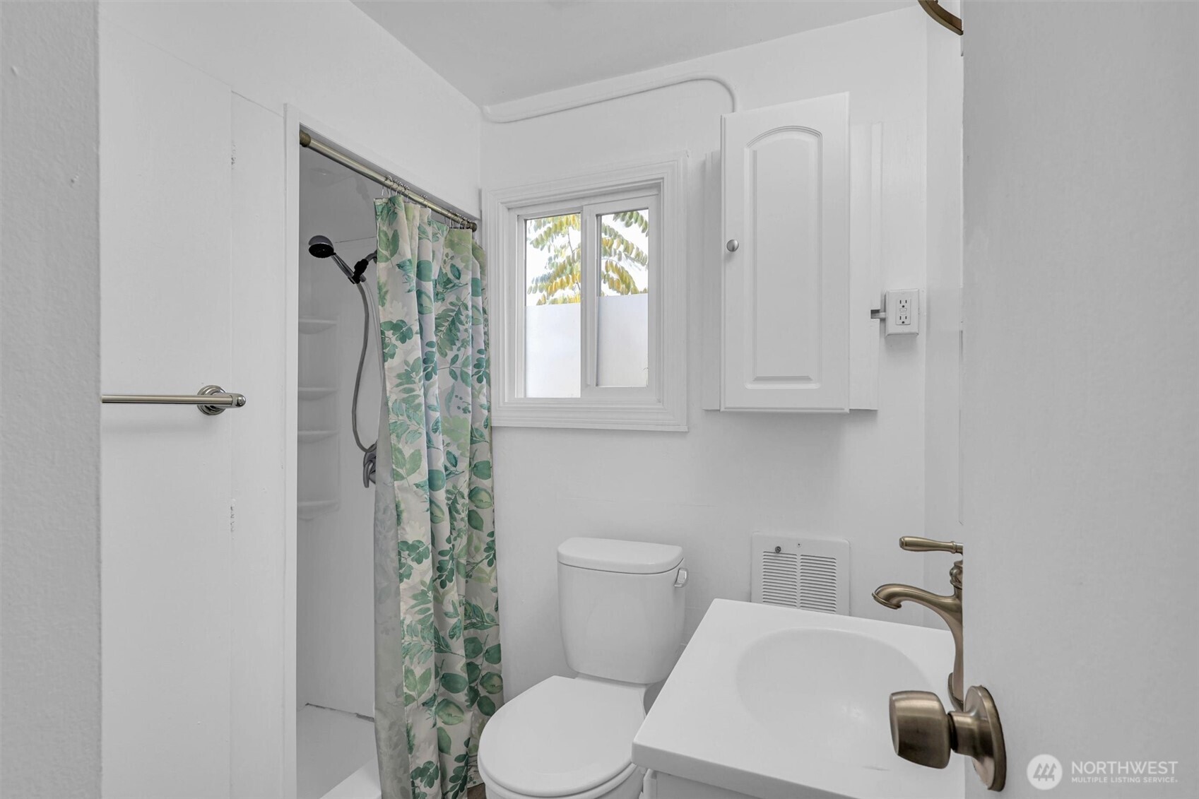 16030 15th Avenue Southwest Burien, WA 98166 - Photo 9 of 19 a bathroom with a toilet a sink and shower