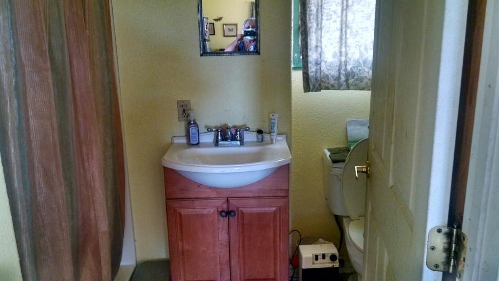 156 Naalae Road Kula, HI 96790 - Photo 5 of 8 a bathroom with a sink and mirror