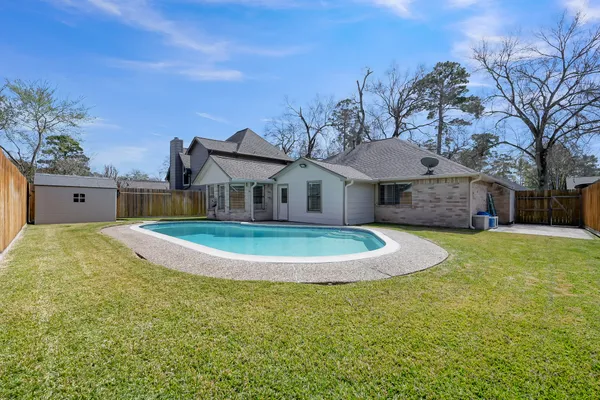 a view of a house with a yard and garage