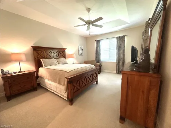 a bedroom with bed and window