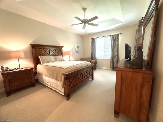 a bedroom with bed and window